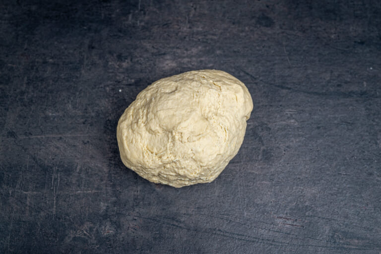 Dividing the grissini dough into two parts Dividing the grissini dough into two parts