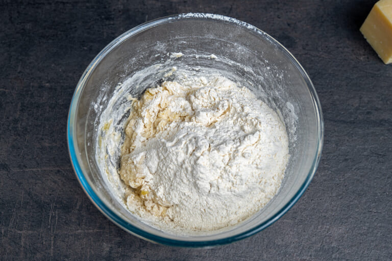 Adding flour for the grissini dough Adding flour for the grissini dough