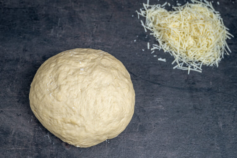 Grating cheese for cheese breadsticks Grating cheese for cheese breadsticks