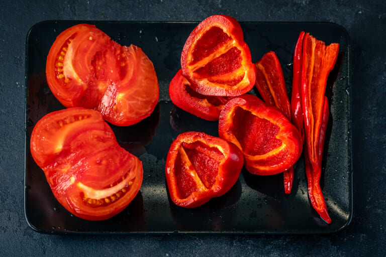 Cleaning tomatoes and peppers for adjika