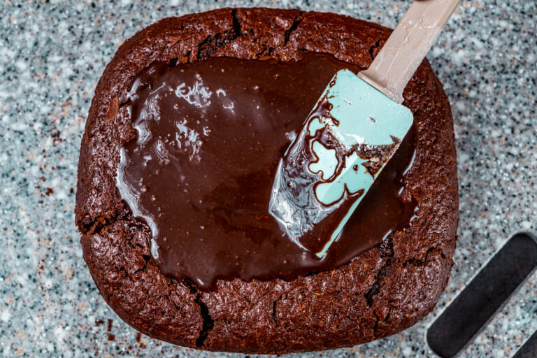 Healthy zucchini brownies drizzled with chocolate frosting Healthy zucchini brownies drizzled with chocolate frosting