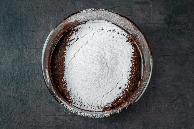 Powdered sugar in a bowl with the frosting Powdered sugar in a bowl with the frosting
