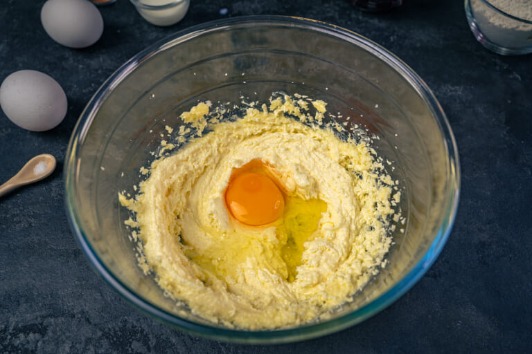 Cherry muffins: Adding eggs one at a time and mixing until smooth