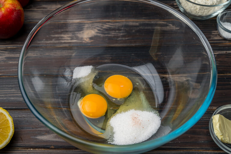 Beating eggs with sugar and salt Beating eggs with sugar and salt