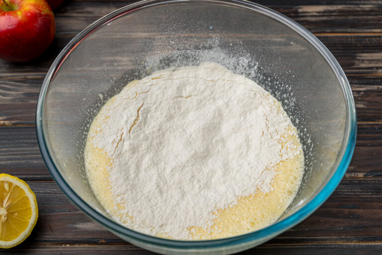 Adding sifted flour and baking powder Adding sifted flour and baking powder