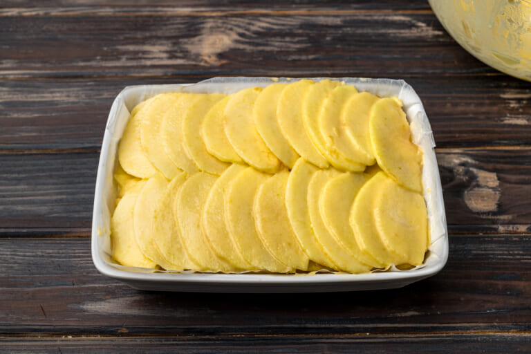 Placing the batter in the baking pan Placing the batter in the baking pan