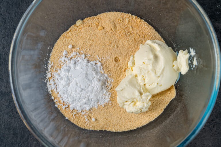 Ladyfinger crumbs with mascarpone and powdered sugar in a bowl