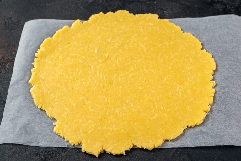 Roll out the dough into a flatbread