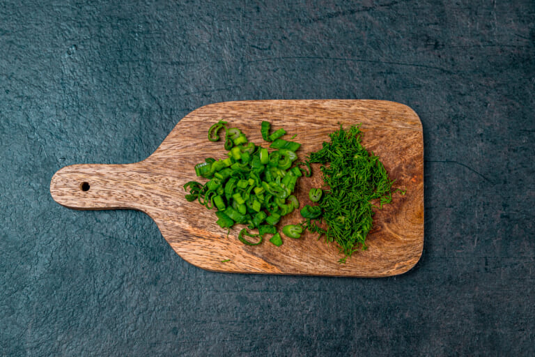 Boiled potatoes: Finely chopping the herbs