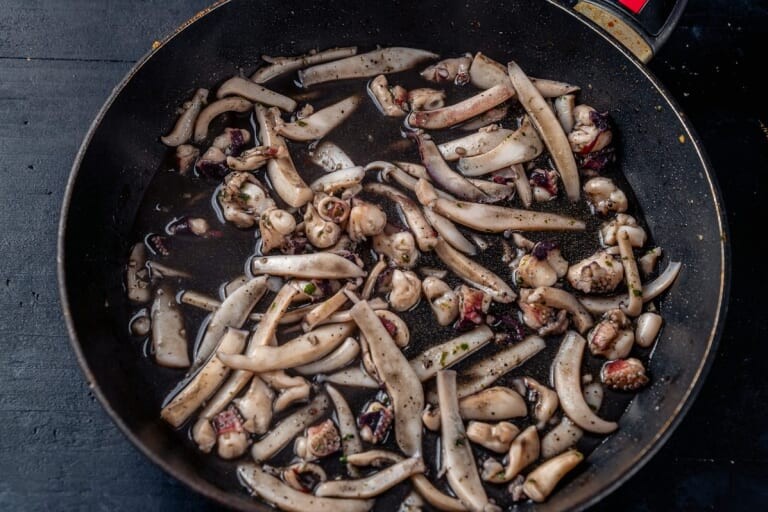 Pieces of cuttlefish in black ink sauce