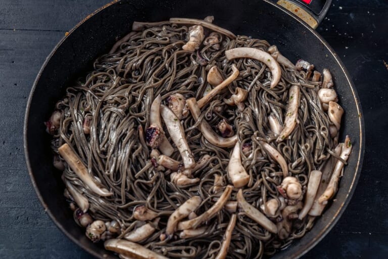 Pasta mixed with ink sauce
