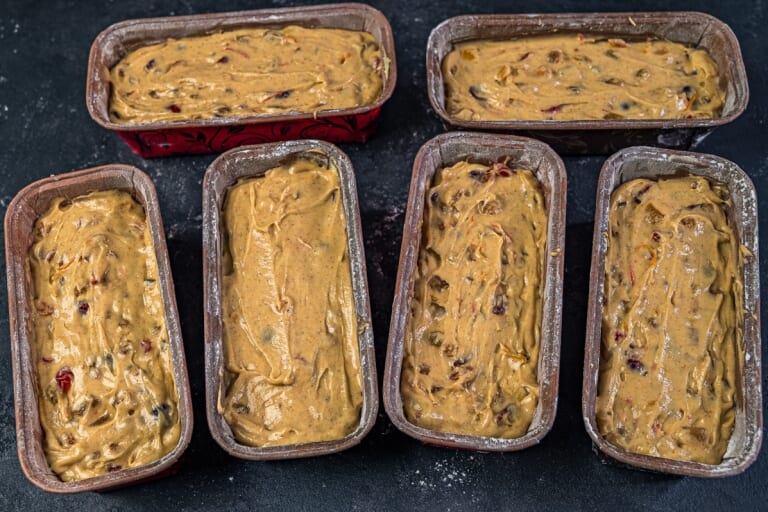 British Christmas Cake Filling the cake pans with batter