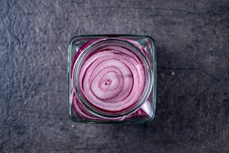 Red onion rings in a jar