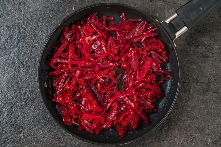 Ukrainian Borscht: Adding Julienned Beets to the Onions