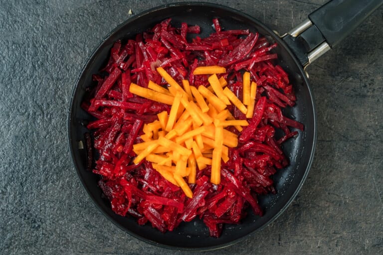 Ukrainian Borscht: Adding Julienned Carrots to the Beet Mixture