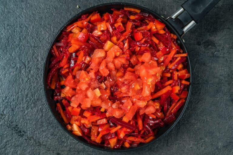 Ukrainian Borscht: Adding Chopped Tomatoes to the Vegetable Base