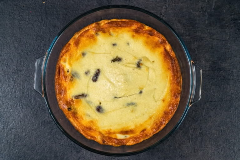 Golden brown Farmer's Cheese and Raisin Bake (Zapekanka) fresh from the oven.