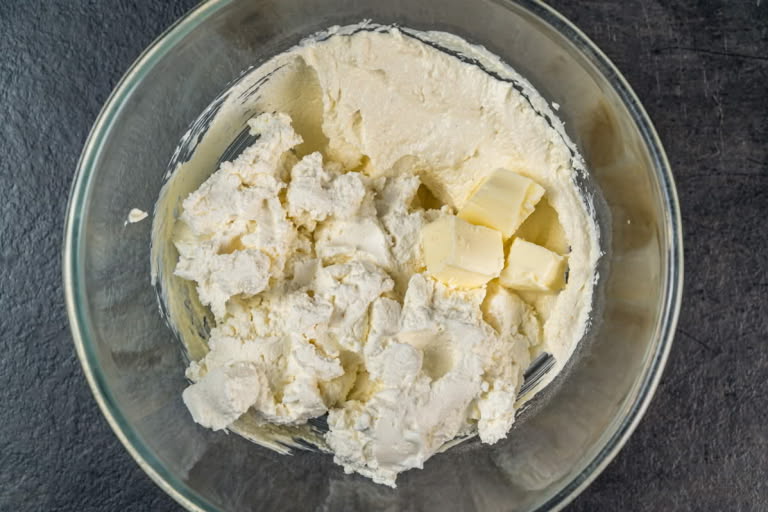 Step 3: Blending farmer's cheese for a smooth Zapekanka batter, with butter and Cream of Wheat mixture nearby. Step 3: Blending farmer's cheese for a smooth Zapekanka batter, with butter and Cream of Wheat mixture nearby.