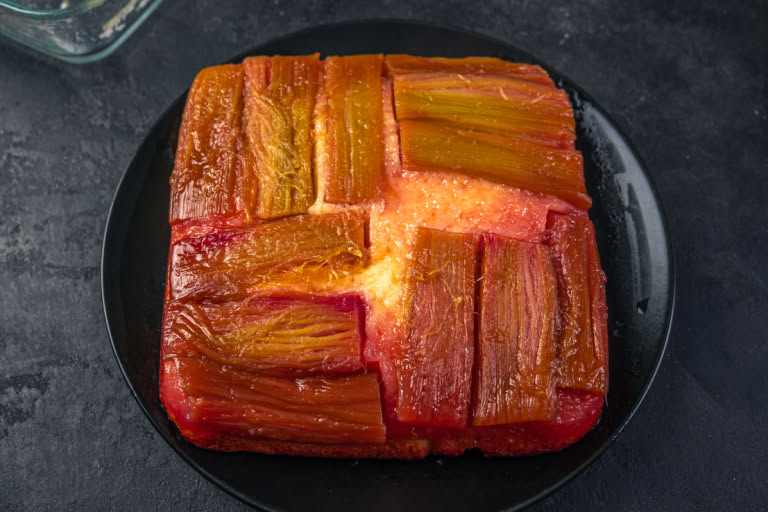 The finished rhubarb upside-down cake showing the glossy fruit topping
