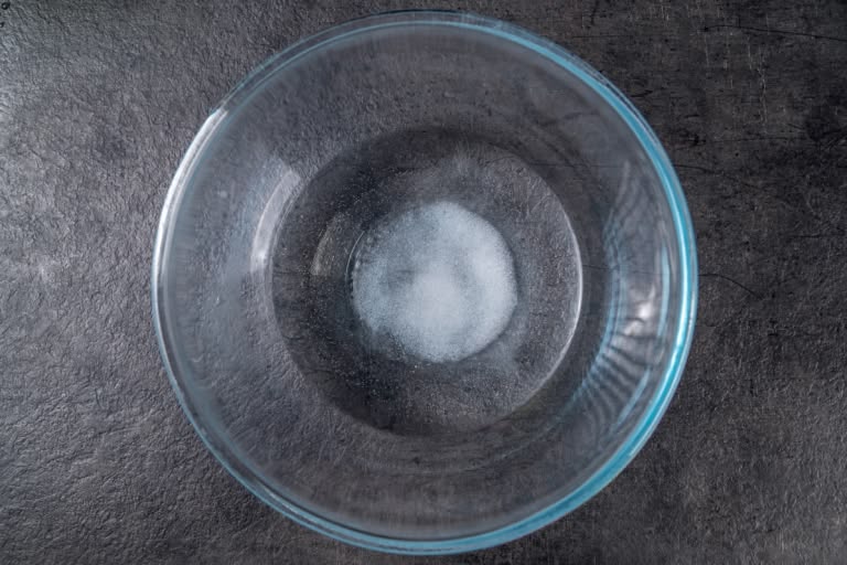Dissolving salt in warm water for pelmeni dough